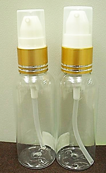 ขวดPET กลม 50ml + ปั้มจุ๊บขาวทองด้านคาดริ้วเงินฝาครอบใส คอ 18 มม.