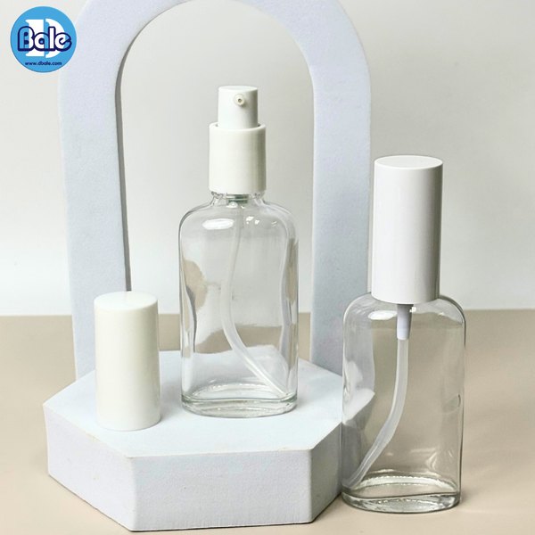 ขวดแก้วทรงแบน+หัวปั๊ม สีใส, ชาใส 50ml. c012