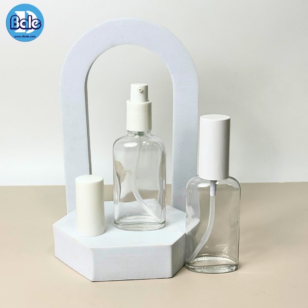 ขวดแก้วทรงแบน+หัวปั๊ม สีใส, ชาใส 50ml. c012